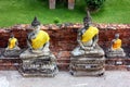 Ancient statues of Buddha of different sizes, in the old temple of Wat Yai Chaimongkol in Ayutthaya, Thailand.