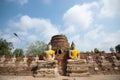 Ancient statues of meditating buddha sitting, at Wat Yai Chaimongkol old temple in Ayutthaya, Thailand Royalty Free Stock Photo