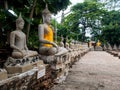 Ancient statues of meditating buddha sitting, at Wat Yai Chaimongkol in Ayutthaya, Thailand Royalty Free Stock Photo