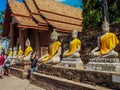 Ancient statues of meditating buddha sitting, at Wat Yai Chaimongkol in Ayutthaya, Thailand, Feb 2019 Royalty Free Stock Photo