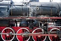 Ancient steam locomotive in steam. Live steam around mechanical Royalty Free Stock Photo