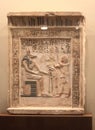 The overseer of king`s household Ipy before the god Anubis. Ancient Egyptian limestone stele from the Hermitage collection