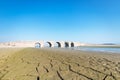 Ancient stone arch bridge against a blue sky Royalty Free Stock Photo