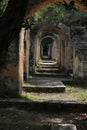 Ancient stone archway leading through a serene garden path