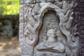 Ancient stone bas-relief in Angkor Wat, Cambodia. Ancient temple decor. Angkor Wat detail. Royalty Free Stock Photo