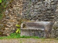 Ancient stone bench along a castle wall