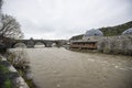 Ancient stone bridge across Kars River & Kars Castle - main tourist attractions of Kars, Turkey. Near flag on castle are portrait Royalty Free Stock Photo