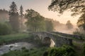 Old Stone Bridge Over Misty River at Dawn Enchanted Landscape Royalty Free Stock Photo