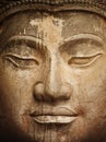 Ancient stone Buddha face close up