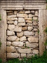 An ancient stone-built door preserved from ancient Greece made of brown stone