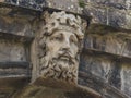 The ancient stone carving of the Foyle River God dating back to 1690 on the Bishop`s Gate in Londonderry in Northern Ireland