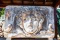 Ancient stone carving of Medusa Head. Royalty Free Stock Photo