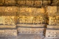 Ancient stone carvings depicting legendary animals or deities on a Dvaravati period stone wall in Si Thep Historical Park