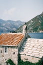 Ancient stone church of Our Lady of the Angels with a belfry on the roof. Donji Stoliv, Montenegro