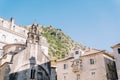 Ancient stone church of St. Luke among the houses at the foot of the mountains. Kotor, Montenegro Royalty Free Stock Photo