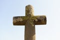 An ancient stone cross under a bright blue sky Royalty Free Stock Photo