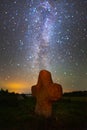 Ancient stone cross under starry sky Royalty Free Stock Photo