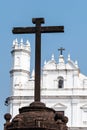 The ancient stone crucifix outside the Portuguese era Church of St. Francis of Assisi in the UNESCO Royalty Free Stock Photo