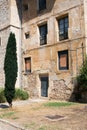 Ancient stone facade of a house and garden in front of it. OÃÂ±a, Burgos, Merindades, Spain,