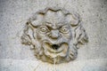 An ancient stone face of a  fountain Royalty Free Stock Photo
