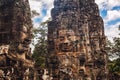 Ancient stone faces of Bayon temple, Angkor, Cambodia Royalty Free Stock Photo