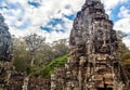 Ancient stone faces of Bayon temple, Angkor, Cambodia Royalty Free Stock Photo