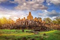 Ancient stone faces of Bayon temple, Angkor Wat, Siam Reap. Royalty Free Stock Photo