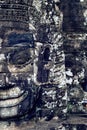 Ancient stone faces of Bayon temple, Angkor Wat, Siam Reap. Royalty Free Stock Photo