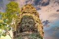 Ancient stone faces at sunset of Bayon temple, Angkor Wat, Siam Reap, Cambodia Royalty Free Stock Photo