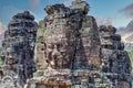 Ancient stone faces at sunset of Bayon temple, Angkor Wat, Siam Reap, Cambodia Royalty Free Stock Photo