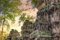 Ancient stone faces at sunset of Bayon temple, Angkor Wat, Siam Reap, Cambodia Royalty Free Stock Photo