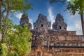 Ancient stone faces at sunset of Bayon temple, Angkor Wat, Siam Reap, Cambodia Royalty Free Stock Photo