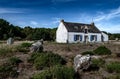 Ancient Stone Field Alignements De Menhir Carnac With Neolithic Megaliths And Old Cottage In Brittany, France