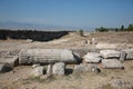 Ancient stone fragments of the Gymnasium building on the ground near the outer wall. Hierapolis, Turkey