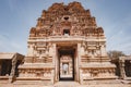 Ancient stone gate with carved elements and bas-reliefs