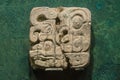 Ancient stone glyph made by the natives of the mexican maya cult