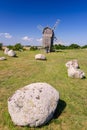 Ancient stone henge in front of traditional windmill Royalty Free Stock Photo