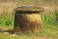 Ancient stone jar with stone cover in a Plain of Jars Site 1 near Phonsavan, Xiangkhouang province, Laos.