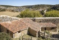 Ancient stone made houses against the wall in Calatanazor town, Soria, Spain
