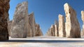 Strategic Vision With Ancient Stone Markers Aligned in a Row Leading Forward in a Clear Blue Sky Setting Royalty Free Stock Photo
