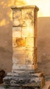 Ancient Stone Pillar Detail with Warm Light Weathered Surface and Minimalist Background Royalty Free Stock Photo