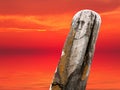 Ancient stone totem sea sunset Royalty Free Stock Photo