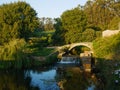 Ancient, stone Roman bridge over River Este in Vila do Conde, Portugal at sunset Royalty Free Stock Photo