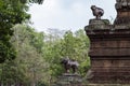 Ancient stone ruin in Angkor Wat temple. Ancient building with mossy statues. Khmer kingdom heritage ruin in jungle.