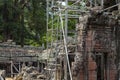 Ancient stone ruin of Banteay Kdei temple, Angkor Wat, Cambodia. Ancient temple restoration with scaffolding.