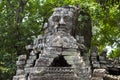 Ancient stone ruin of Banteay Kdei temple, Angkor Wat, Cambodia. Ancient temple tower with face in forest Royalty Free Stock Photo