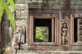 Ancient stone ruin of Banteay Kdei temple, Angkor Wat, Cambodia. Ancient temple window to green forest Royalty Free Stock Photo