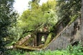 Ancient stone ruins in a leafy garden of Sintra Royalty Free Stock Photo