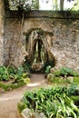 Ancient stone ruins in a leafy garden of Sintra Royalty Free Stock Photo