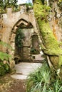 Ancient stone ruins in a leafy garden of Sintra Royalty Free Stock Photo